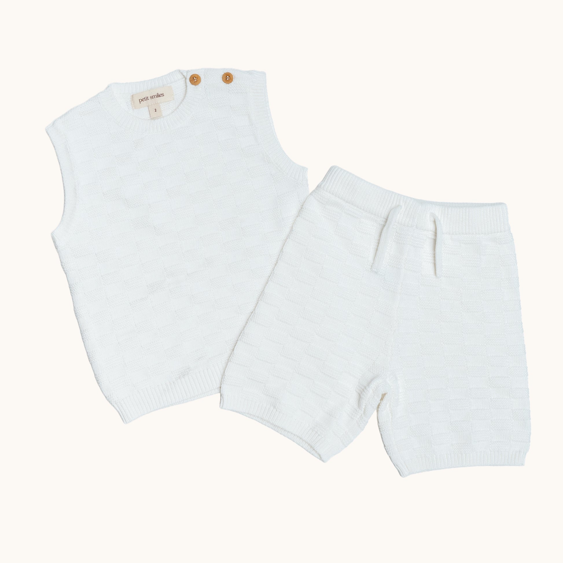 KNITTED BERMUDA SHORTS - CREAM; 100% Organic Cotton; Shorts made from GOTS-certified organic cotton; Elasticated waistband; Relaxed fit.