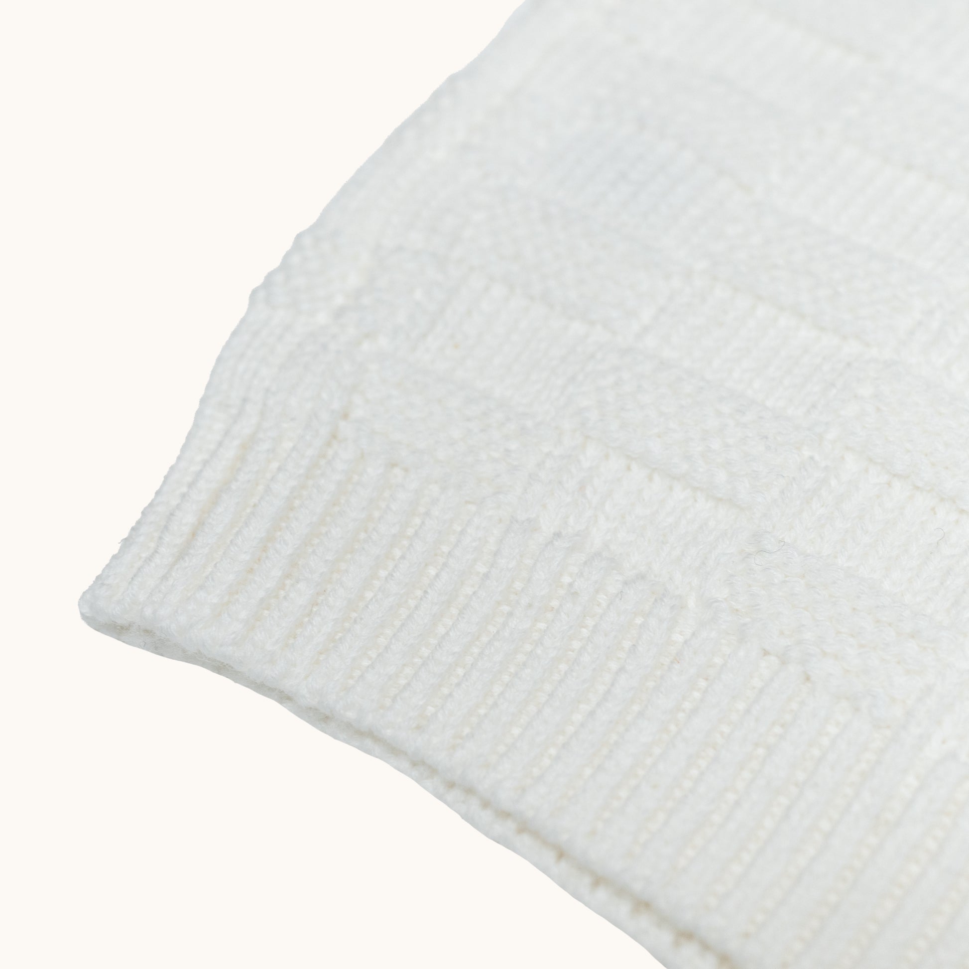 KNITTED BUTTONED WAISTCOAT - CREAM; 100% Organic Cotton; Waistcoat made from GOTS-certified organic cotton; Wooden button at shoulder for easy dressing; Rib finish at neck, hem and cuffs; Relaxed fit.