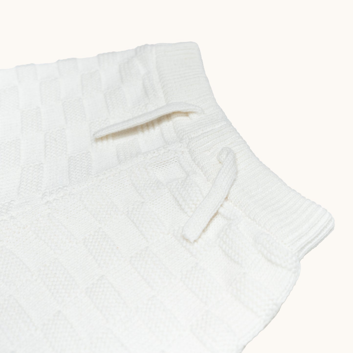 KNITTED BERMUDA SHORTS - CREAM; 100% Organic Cotton; Shorts made from GOTS-certified organic cotton; Elasticated waistband; Relaxed fit.