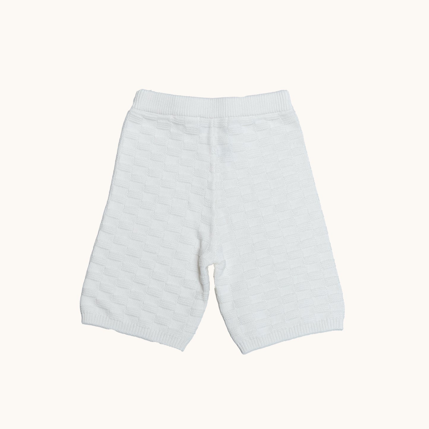 KNITTED BERMUDA SHORTS - CREAM; 100% Organic Cotton; Shorts made from GOTS-certified organic cotton; Elasticated waistband; Relaxed fit.
