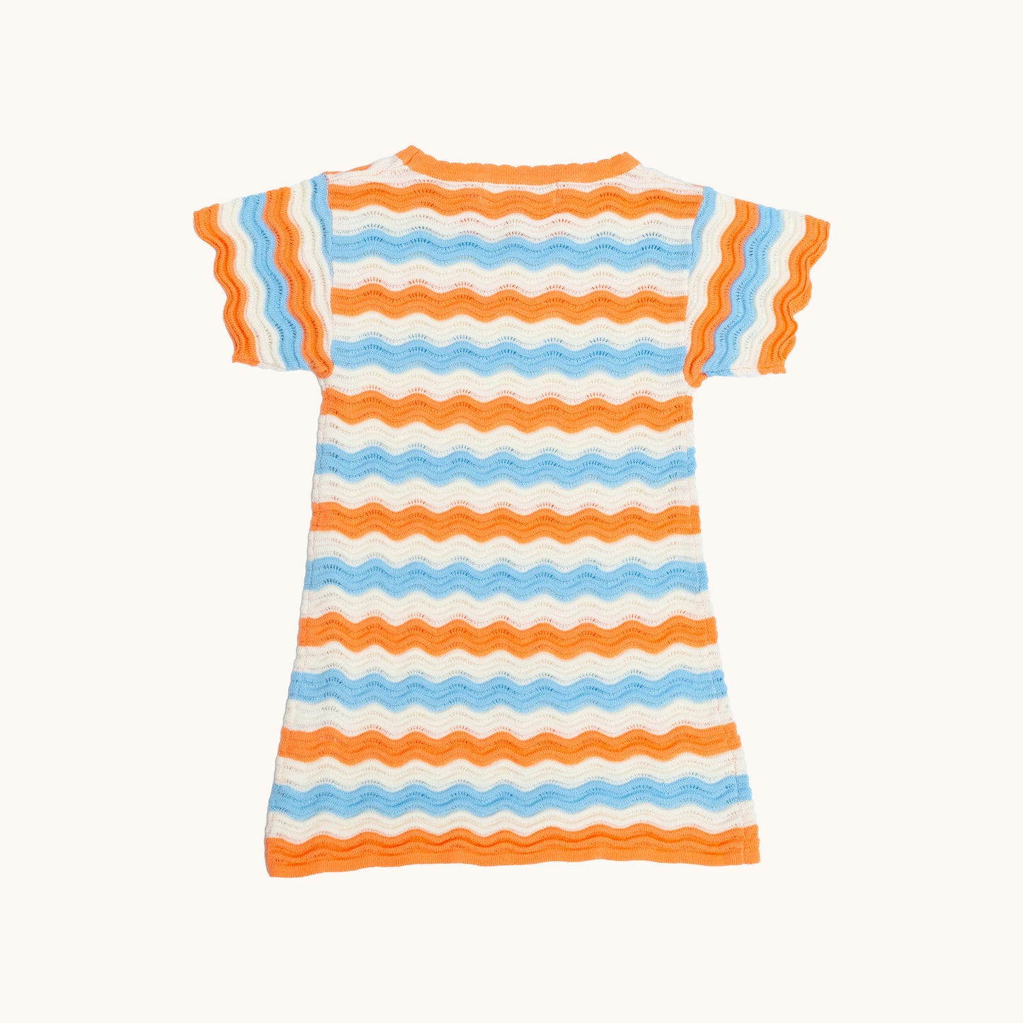 KNITTED WAVY SUMMER DRESS - CORAL; 100% Organic Cotton; Summer Dress made from GOTS-certified organic cotton; Scalloped edge at cuffs; Rib finish at hem; Dropped shoulder.