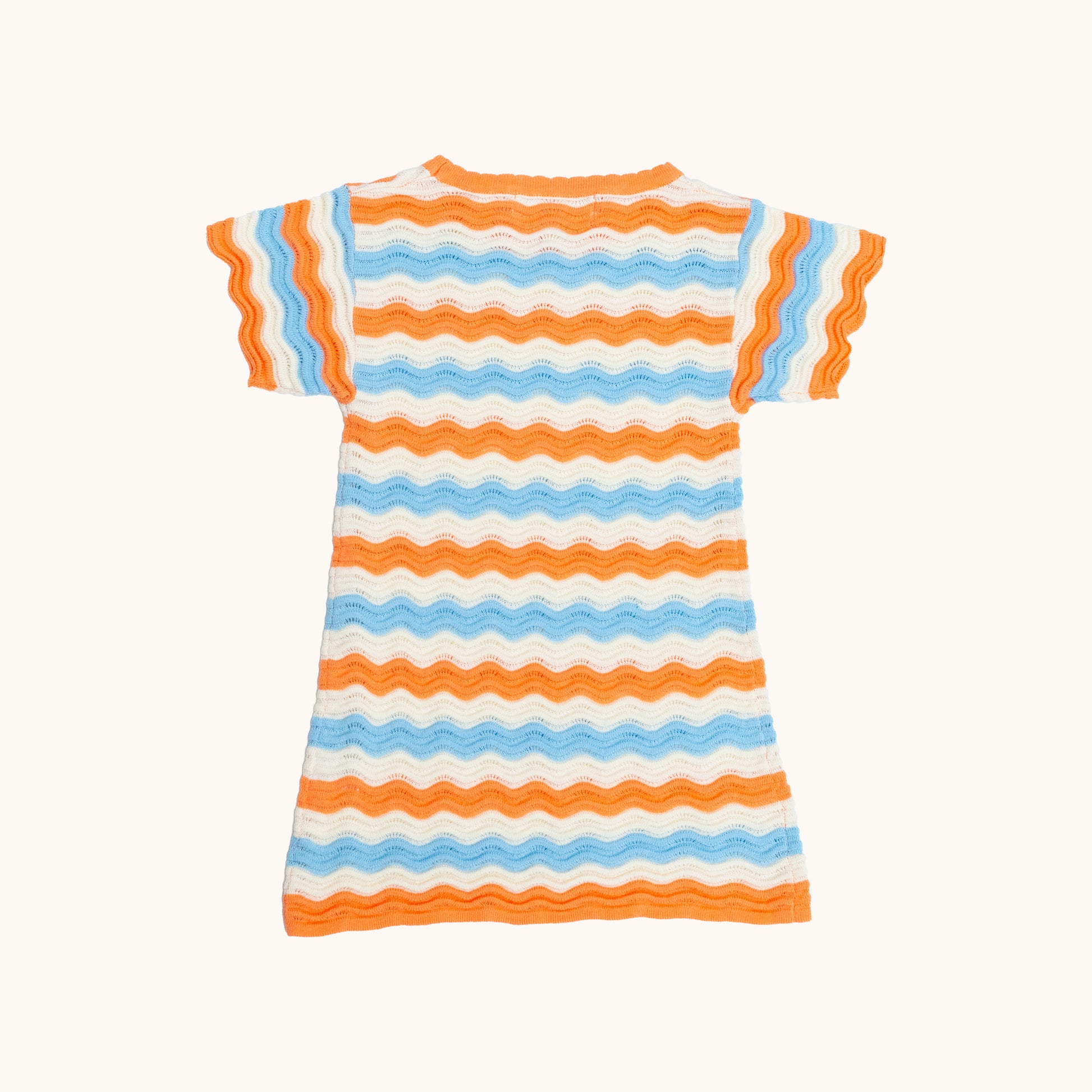 KNITTED WAVY SUMMER DRESS - CORAL; 100% Organic Cotton; Summer Dress made from GOTS-certified organic cotton; Scalloped edge at cuffs; Rib finish at hem; Dropped shoulder.