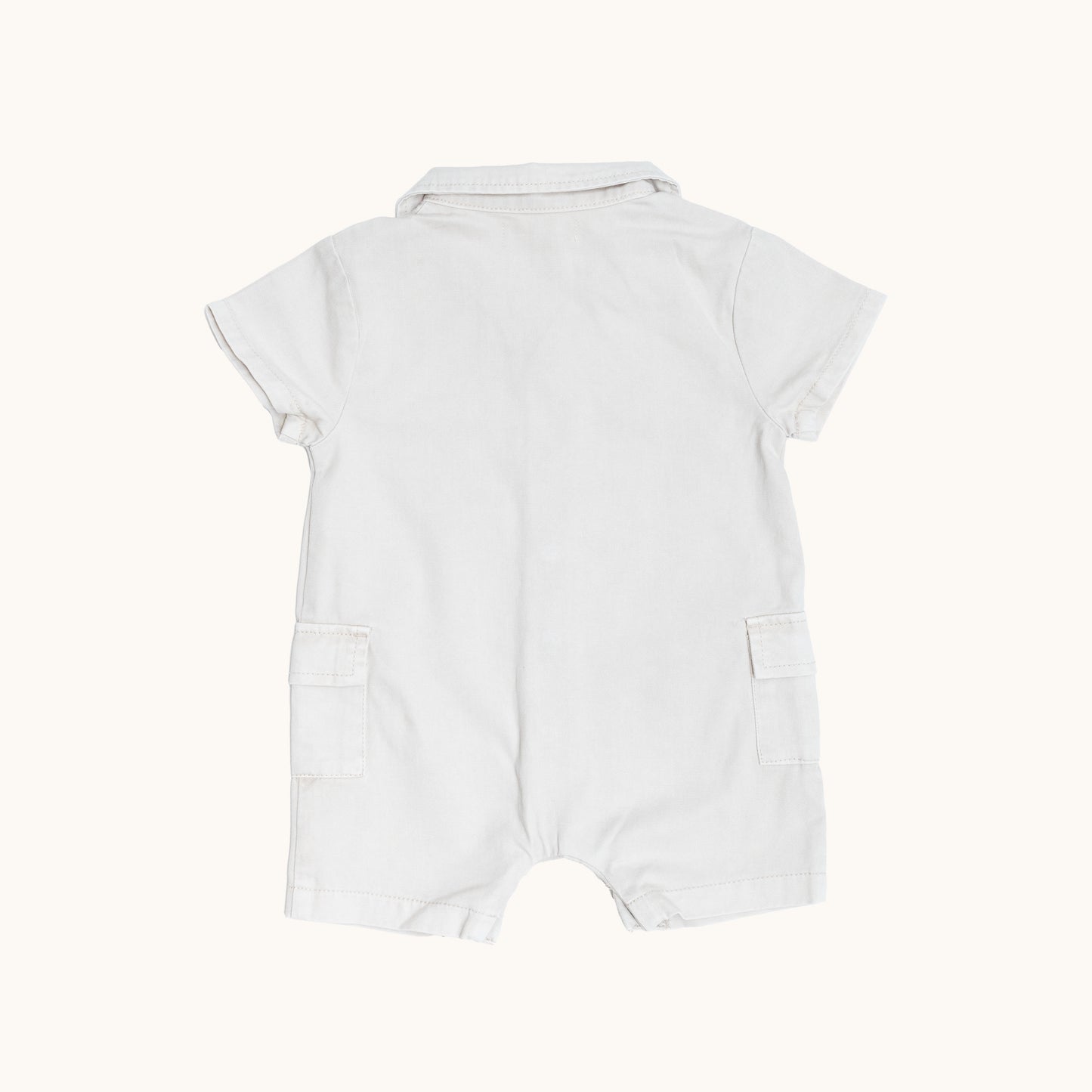 ORGANIC COLLAR JERSEY ROMPERS; 100% Organic Cotton Twill; Made from GOTS-certified organic cotton twill; Press snaps at front and crotch for easy dressing; Patch pockets at the sides; Relaxed fit. 