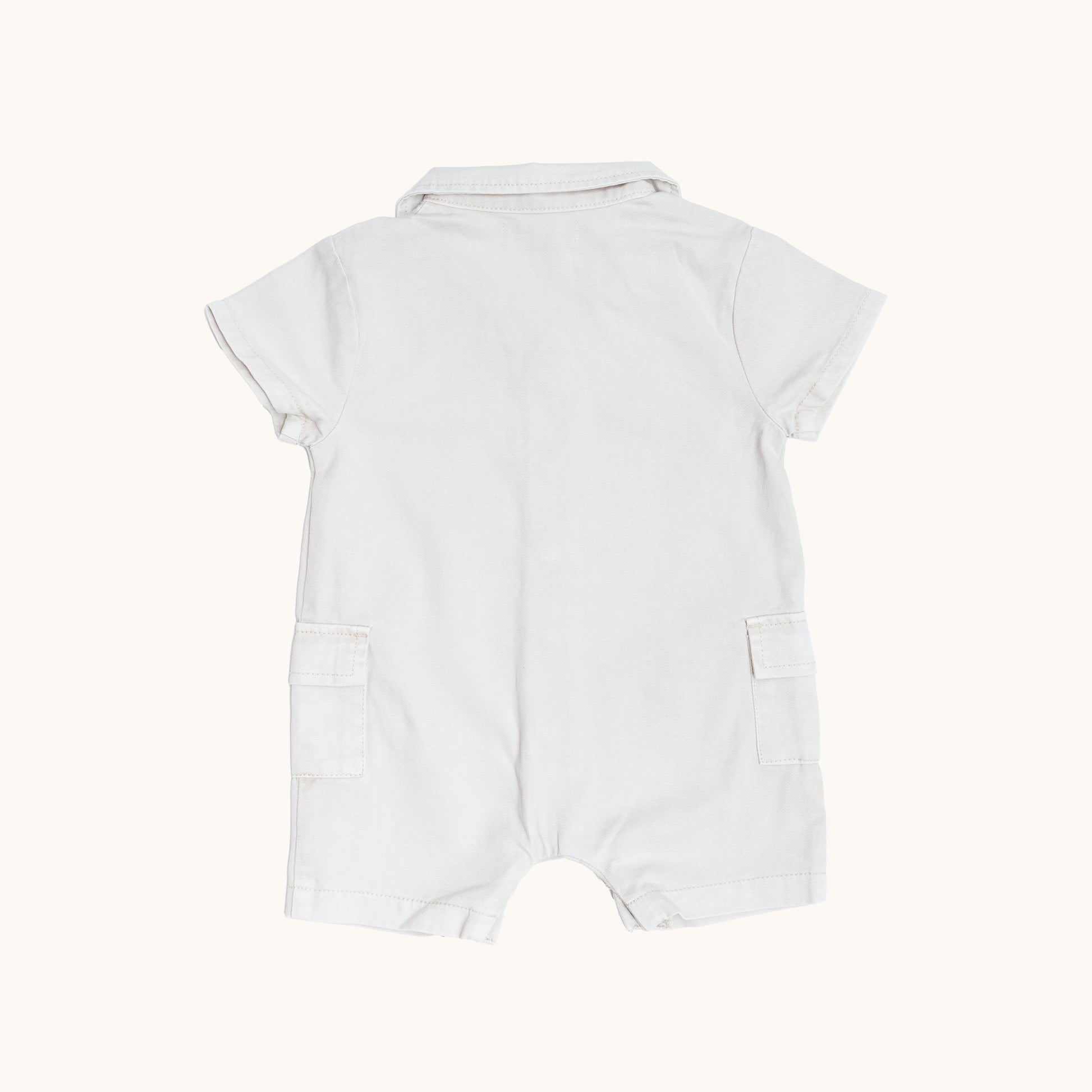 ORGANIC COLLAR JERSEY ROMPERS; 100% Organic Cotton Twill; Made from GOTS-certified organic cotton twill; Press snaps at front and crotch for easy dressing; Patch pockets at the sides; Relaxed fit. 