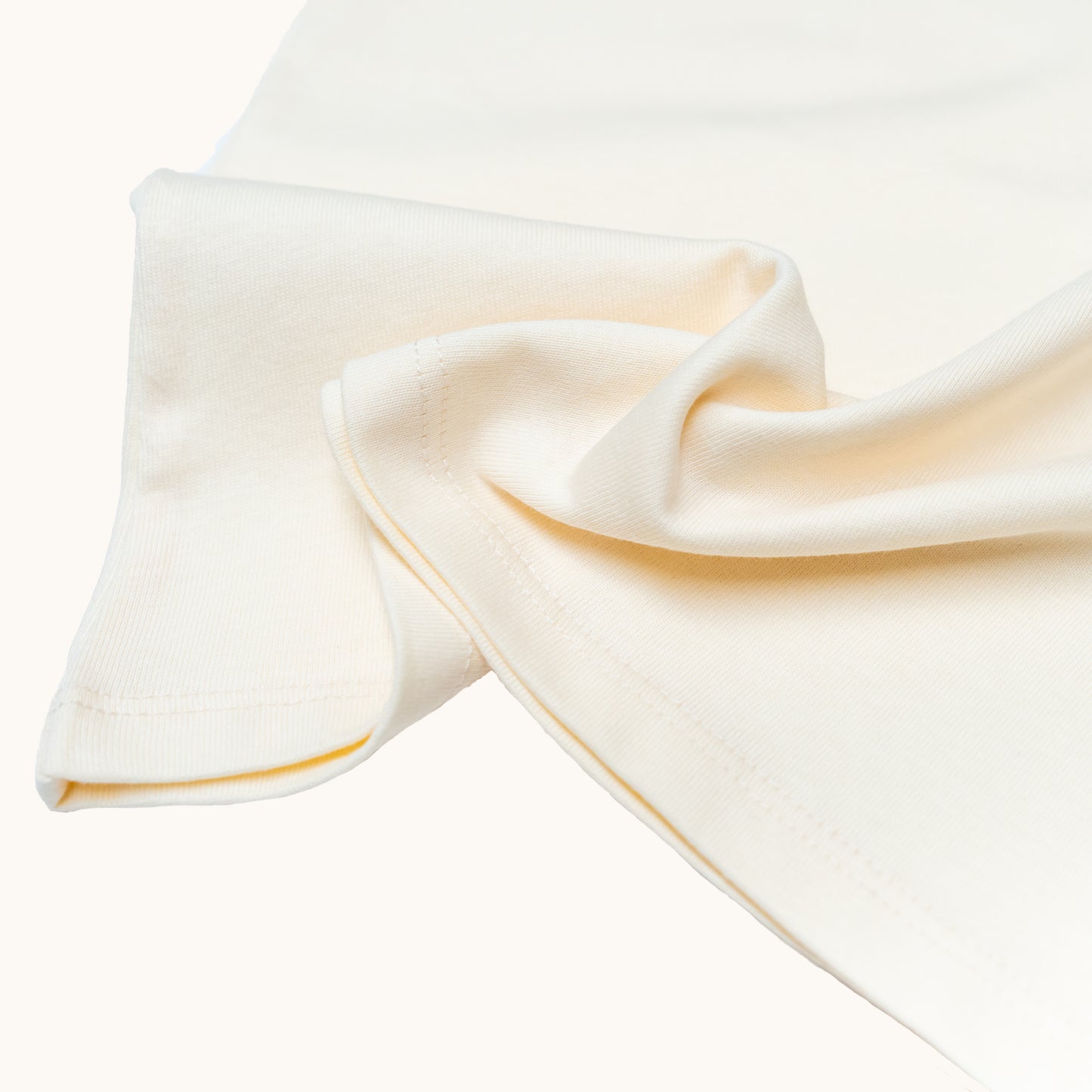 ADULT ORGANIC COTTON TEE; Made from 100% Organic Cotton; GOTS, Organic, certified by CUC-03-03149773; Warm and cozy in Milk colour; Rib band at neck edge; Relaxed fit