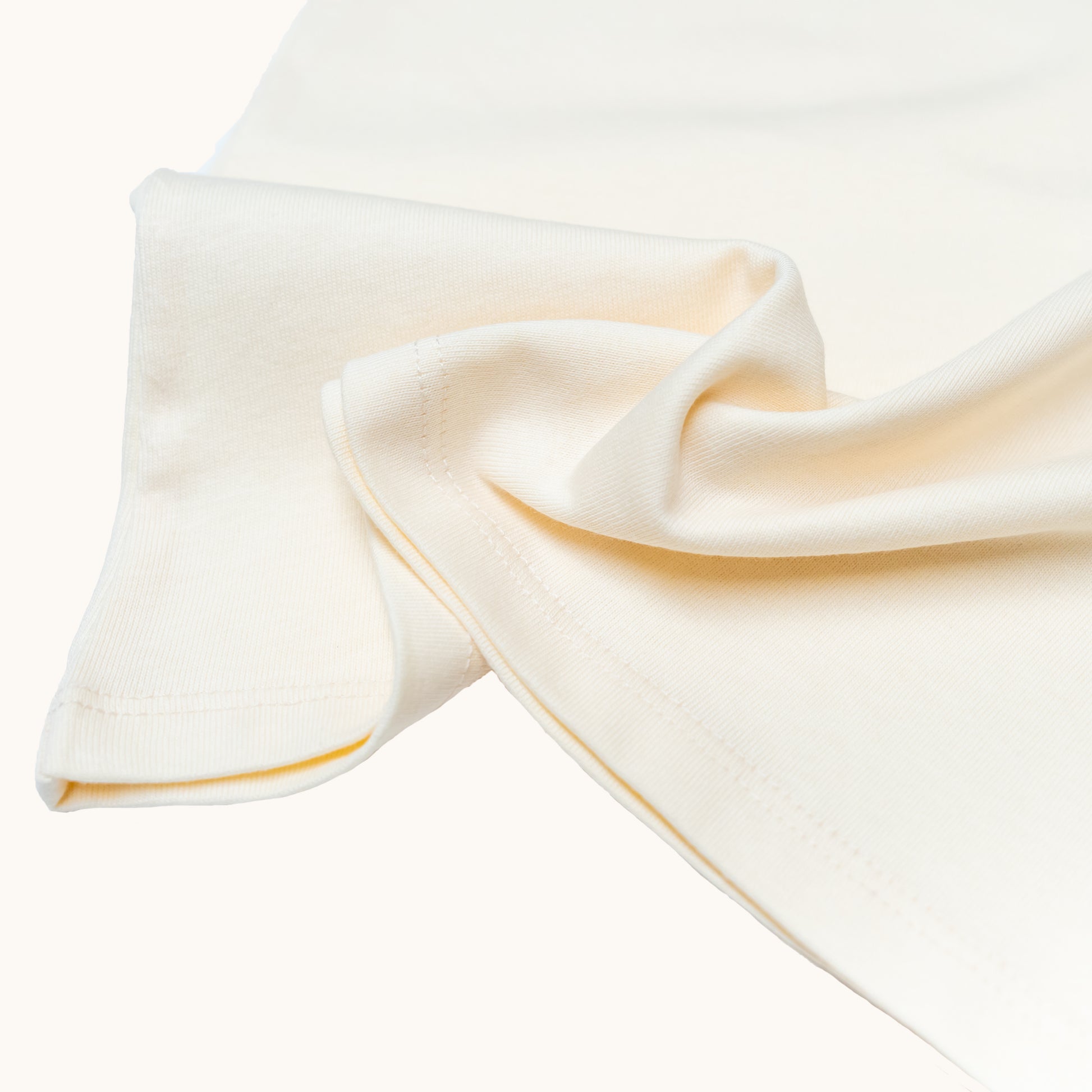 ADULT ORGANIC COTTON TEE; Made from 100% Organic Cotton; GOTS, Organic, certified by CUC-03-03149773; Warm and cozy in Milk colour; Rib band at neck edge; Relaxed fit