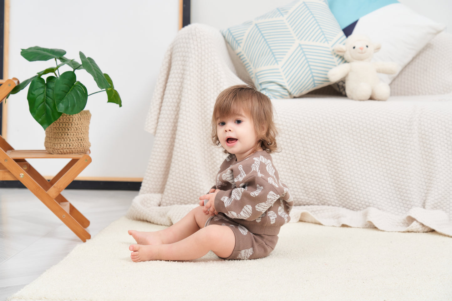 KNITTED SPOTS ROMPER WITH BLOOMERS - CHOCO; 100% Organic Cotton; Jacquard Romper made from GOTS-certified organic cotton; 'CHOCO SPOTS' Jacquard pattern; Rib hem at neck, cuffs and leg opening; Features convenient press snaps at the crotch for effortless dressing; Oversized fit.