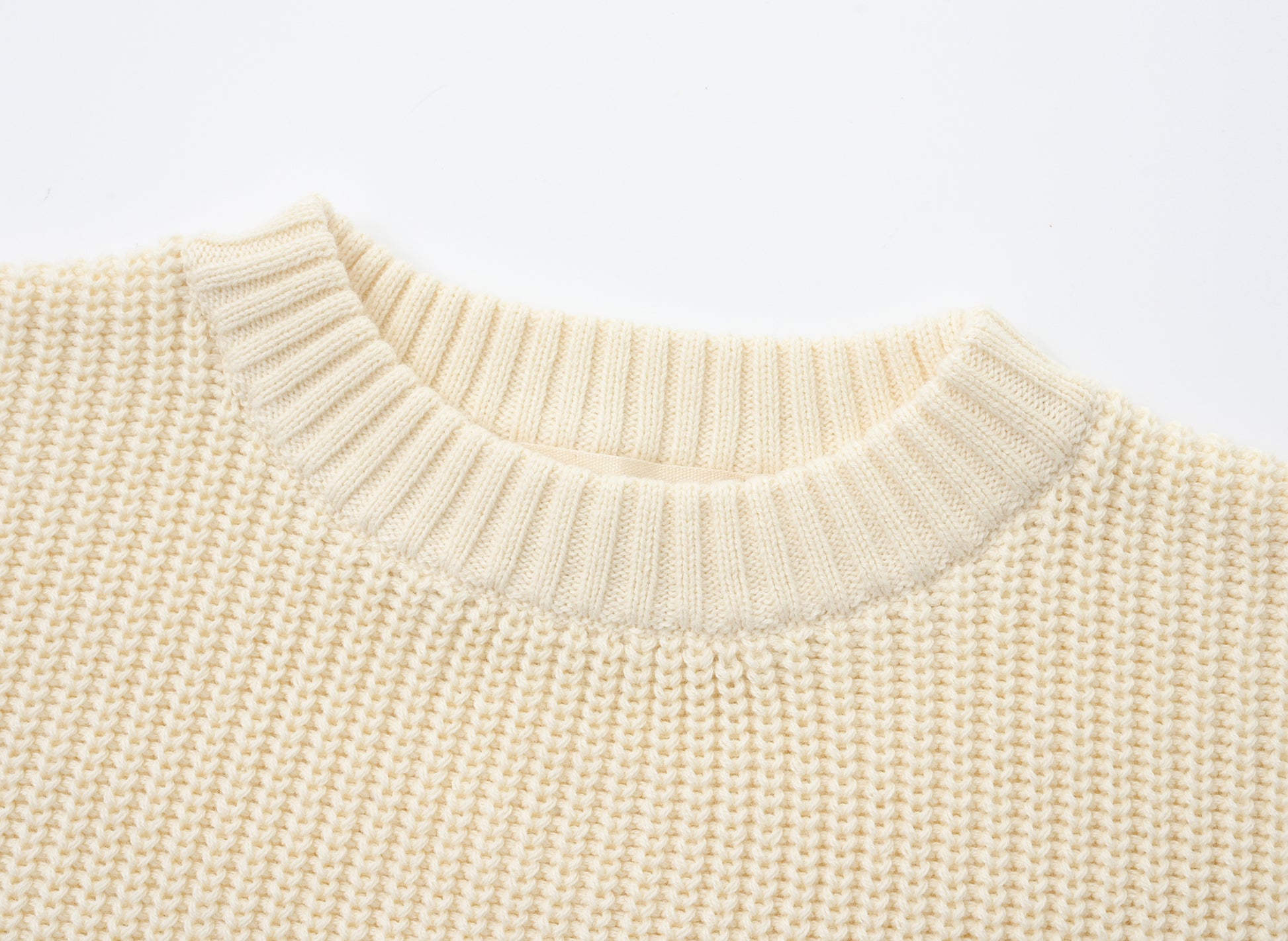 KNITTED PURE PULL OVER - CREAM; 100% Organic Cotton; Pull Over made from GOTS-certified organic cotton; Rib finish at neck, cuffs and hem; Dropped shoulder; Relaxed fit.