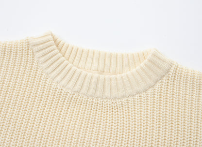 KNITTED PURE PULL OVER - CREAM; 100% Organic Cotton; Pull Over made from GOTS-certified organic cotton; Rib finish at neck, cuffs and hem; Dropped shoulder; Relaxed fit.