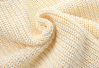 KNITTED PURE PULL OVER - CREAM; 100% Organic Cotton; Pull Over made from GOTS-certified organic cotton; Rib finish at neck, cuffs and hem; Dropped shoulder; Relaxed fit.