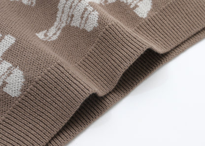 KNITTED SPOTS PULL OVER - CHOCO; 100% Organic Cotton; Jacquard Pull Over made from GOTS-certified organic cotton; 'Choco Spots' Jacquard pattern; Rib finish at neck, cuffs and hem; Dropped shoulder; Relaxed fit. 