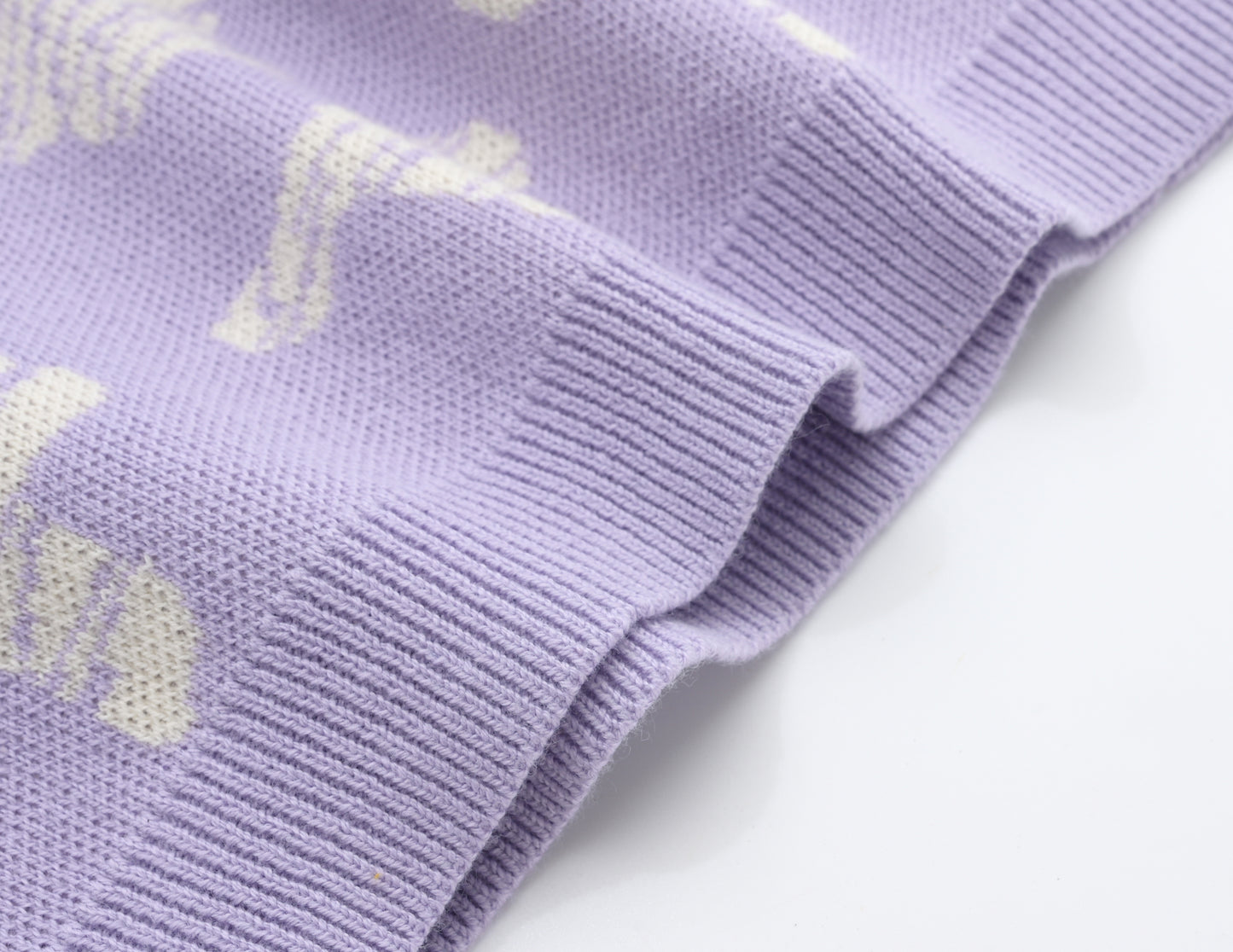 KNITTED SPOTS PULL OVER - TARO; 100% Organic Cotton; Jacquard Pull Over made from GOTS-certified organic cotton; 'Taro Spots' Jacquard pattern; Rib finish at neck, cuffs and hem; Dropped shoulder; Relaxed fit.