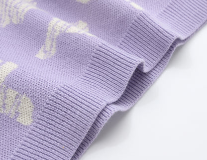 KNITTED SPOTS PULL OVER - TARO; 100% Organic Cotton; Jacquard Pull Over made from GOTS-certified organic cotton; 'Taro Spots' Jacquard pattern; Rib finish at neck, cuffs and hem; Dropped shoulder; Relaxed fit.