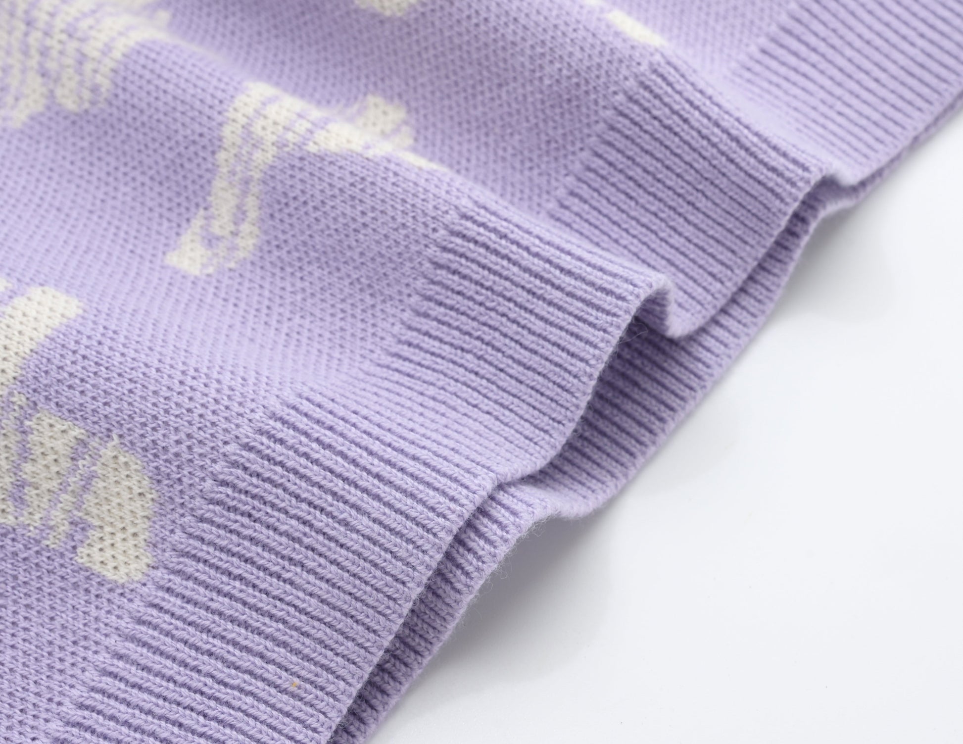 KNITTED SPOTS PULL OVER WITH PANT - TARO; 100% Organic Cotton; Jacquard Pull Over made from GOTS-certified organic cotton; 'Taro Spots' Jacquard pattern; Rib finish at neck, cuffs and hem; Dropped shoulder; Relaxed fit.