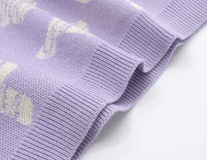 KNITTED SPOTS PULL OVER WITH PANT - TARO; 100% Organic Cotton; Jacquard Pull Over made from GOTS-certified organic cotton; 'Taro Spots' Jacquard pattern; Rib finish at neck, cuffs and hem; Dropped shoulder; Relaxed fit.