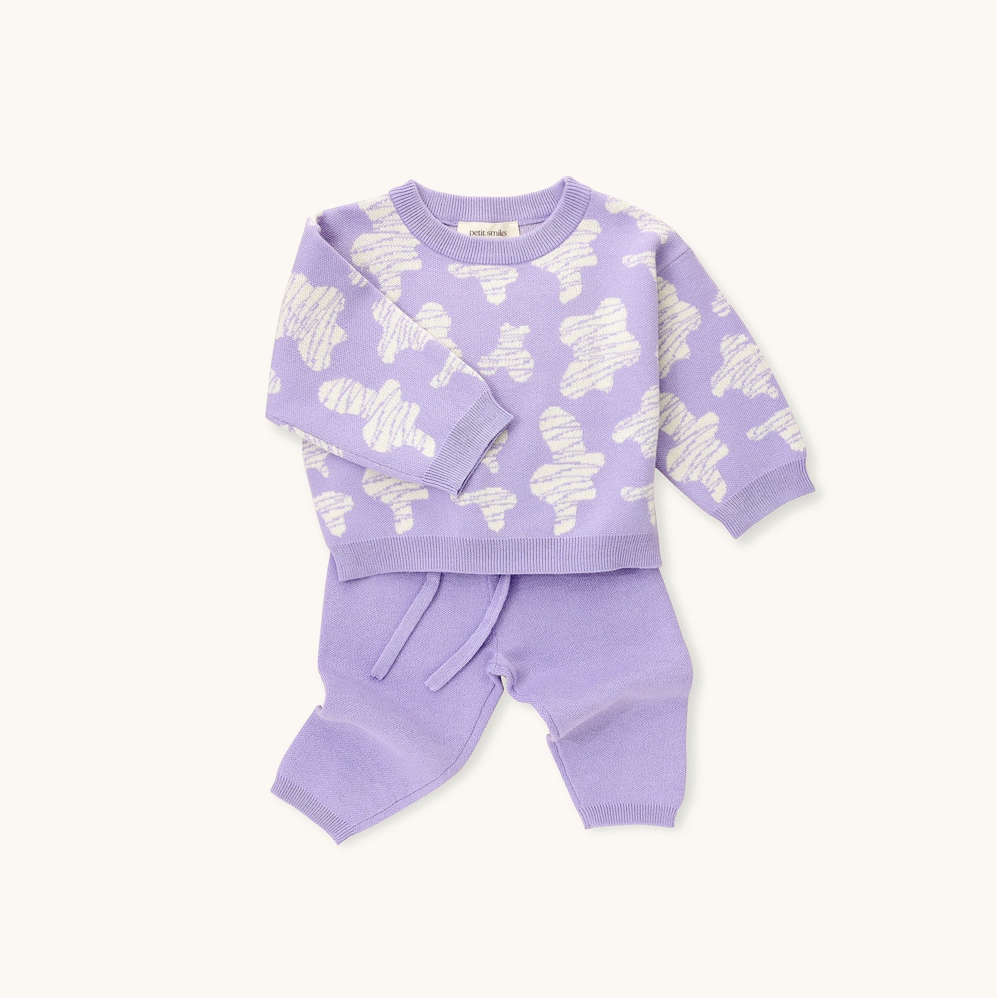 KNITTED SPOTS PULL OVER - TARO; 100% Organic Cotton; Jacquard Pull Over made from GOTS-certified organic cotton; 'Taro Spots' Jacquard pattern; Rib finish at neck, cuffs and hem; Dropped shoulder; Relaxed fit.