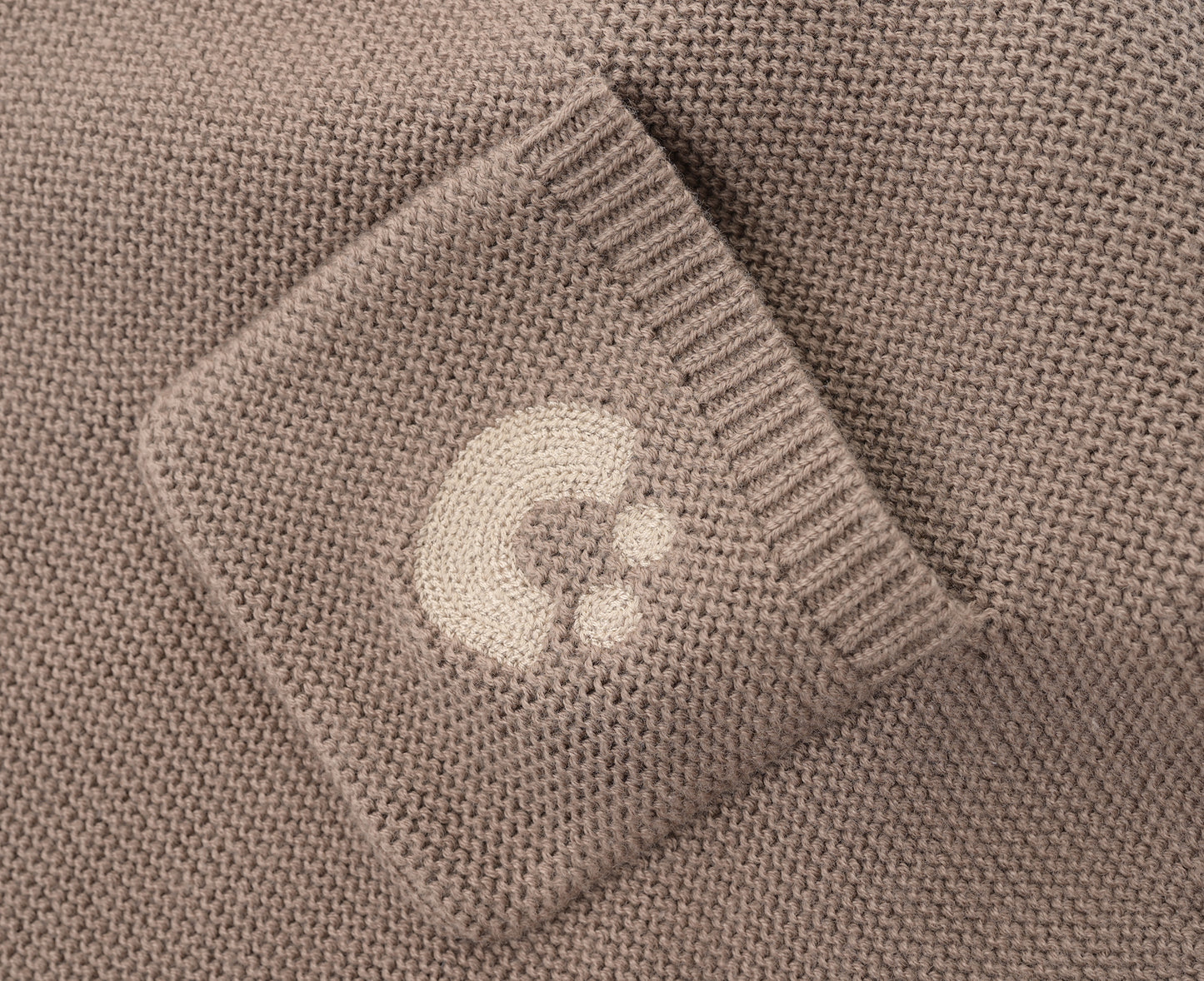 KNITTED SINGLESUIT - CHOCO; 100% Organic Cotton; Jacquard singletsuit made from GOTS-certified organic cotton; Features convenient press snaps at the crotch for effortless dressing; Rib finish and neck, armholes and leg opening.