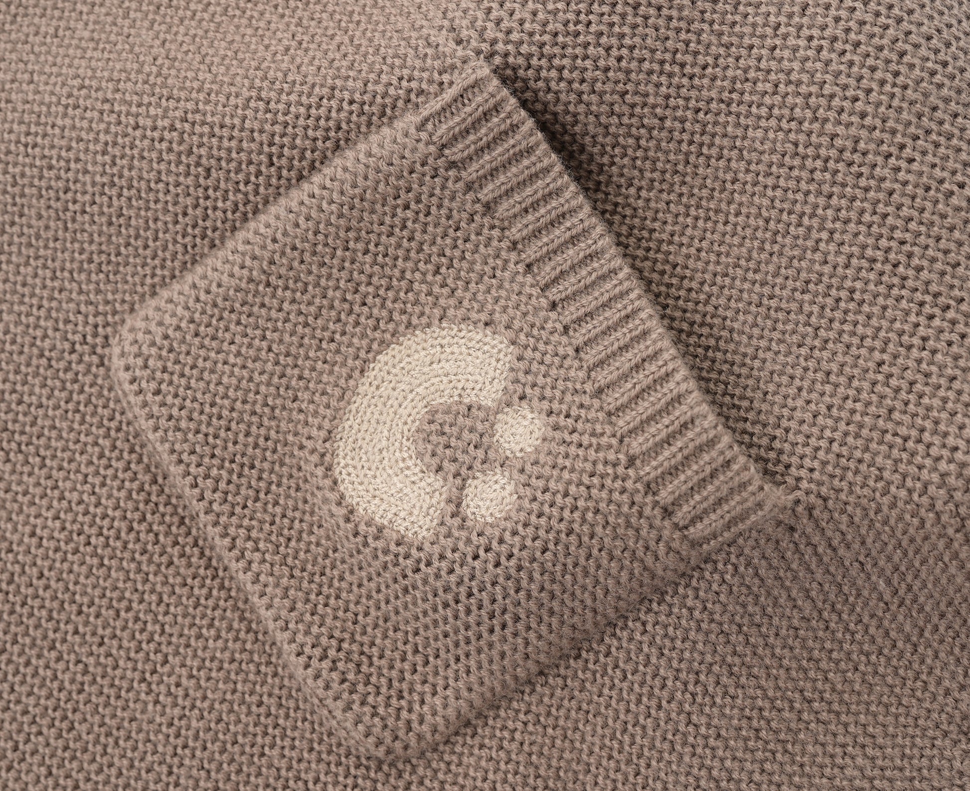 KNITTED SINGLESUIT - CHOCO; 100% Organic Cotton; Jacquard singletsuit made from GOTS-certified organic cotton; Features convenient press snaps at the crotch for effortless dressing; Rib finish and neck, armholes and leg opening.