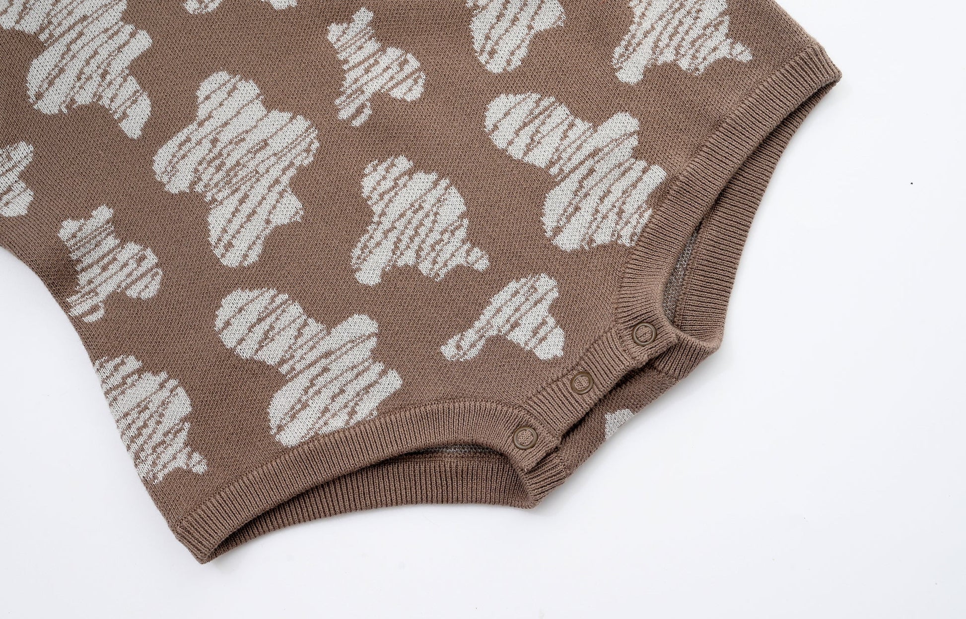 KNITTED SPOTS ROMPER WITH BLOOMERS - CHOCO; 100% Organic Cotton; Jacquard Romper made from GOTS-certified organic cotton; 'CHOCO SPOTS' Jacquard pattern; Rib hem at neck, cuffs and leg opening; Features convenient press snaps at the crotch for effortless dressing; Oversized fit.