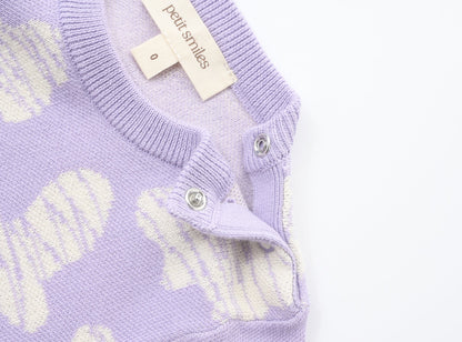 KNITTED SPOTS ROMPER - TARO; 100% Organic Cotton; Jacquard Romper made from GOTS-certified organic cotton; 'TARO SPOTS' Jacquard pattern; Rib hem at neck, cuffs and leg opening; Features convenient press snaps at the crotch for effortless dressing; Oversized fit.