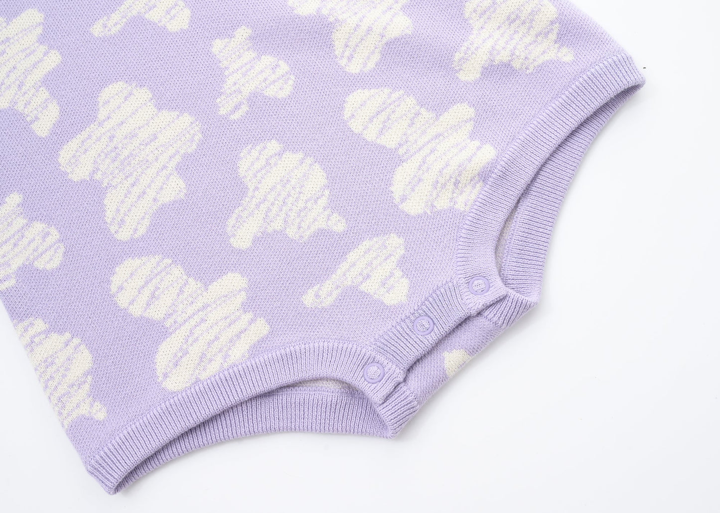 KNITTED SPOTS ROMPER - TARO; 100% Organic Cotton; Jacquard Romper made from GOTS-certified organic cotton; 'TARO SPOTS' Jacquard pattern; Rib hem at neck, cuffs and leg opening; Features convenient press snaps at the crotch for effortless dressing; Oversized fit.