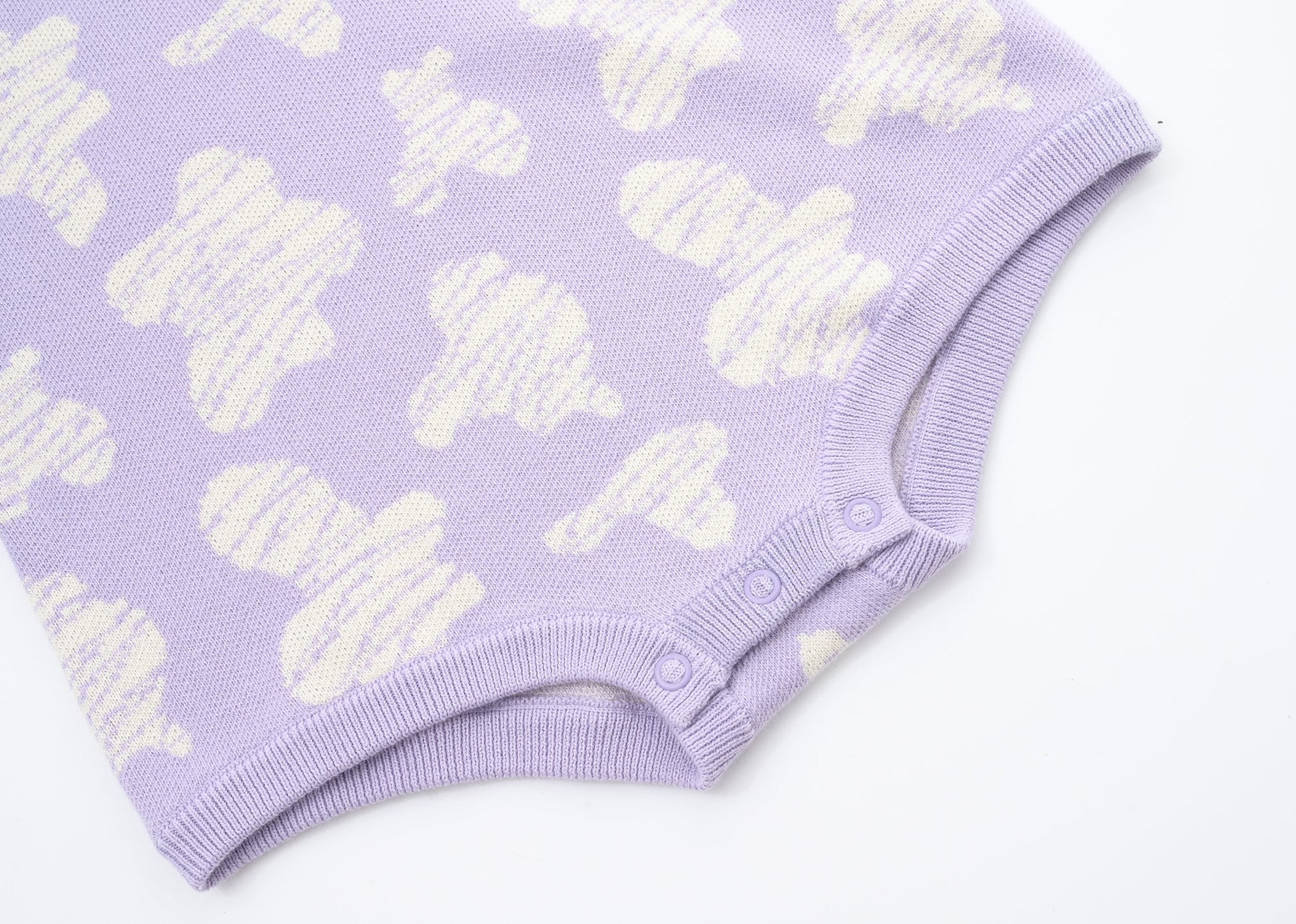 KNITTED SPOTS ROMPER - TARO; 100% Organic Cotton; Jacquard Romper made from GOTS-certified organic cotton; 'TARO SPOTS' Jacquard pattern; Rib hem at neck, cuffs and leg opening; Features convenient press snaps at the crotch for effortless dressing; Oversized fit.