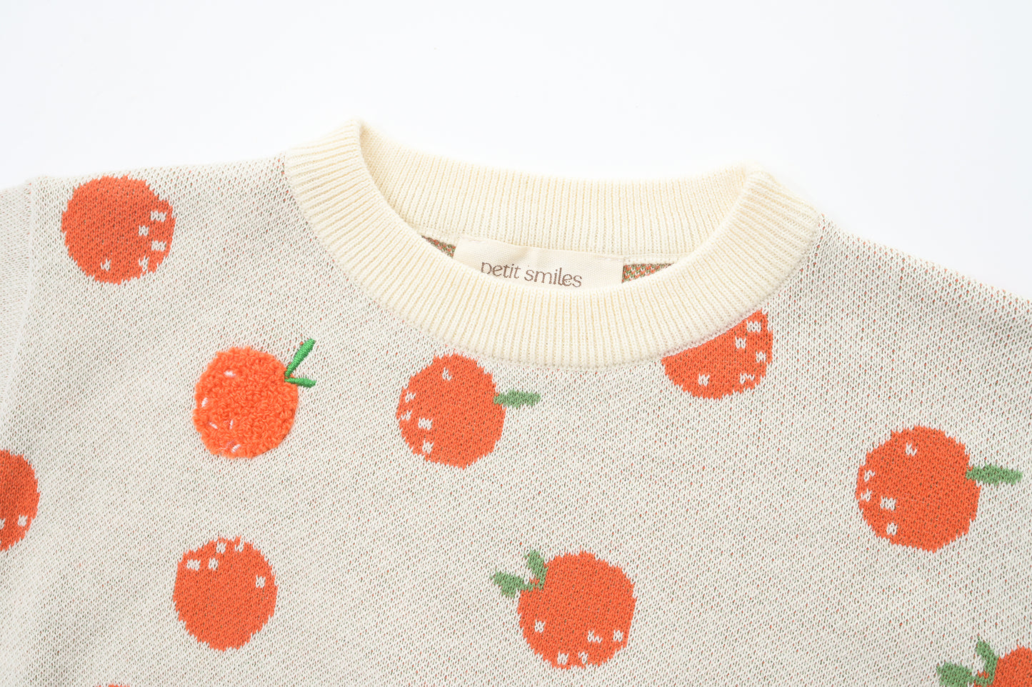 BABIES & KIDS KNITTED PULL OVER - CNY; 100% Organic Cotton; Jacquard Pull Over made from GOTS-certified organic cotton; 'Tangerine' Jacquard pattern with some towel embroidery artwork techniques; Rib finish at neck, cuffs and hem; Dropped shoulder; Relaxed fit; The younger model wears size 0; older model wears size 4.