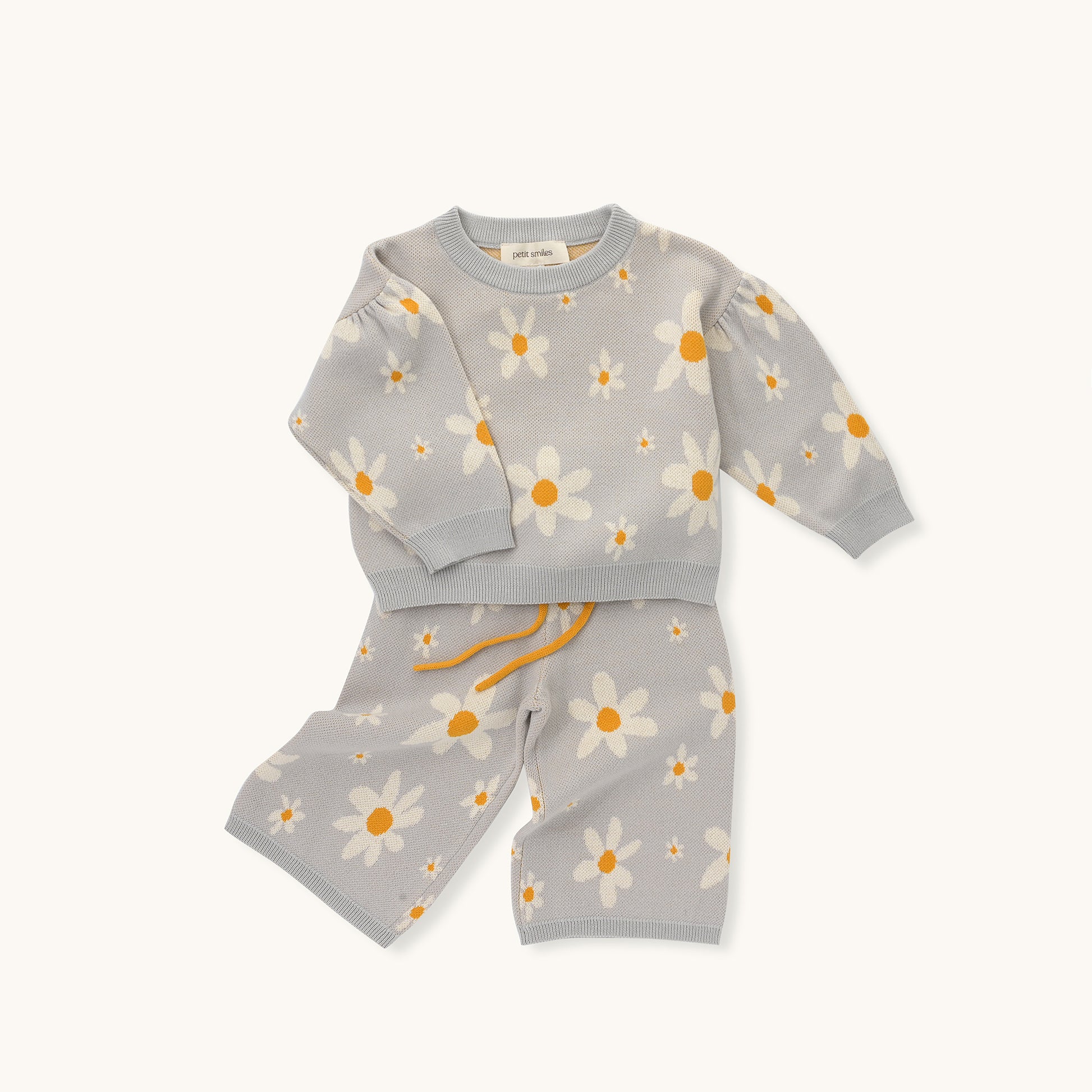 ORGANIC PANT - FLORAL; 100% Organic Cotton; Jacquard Pull Over made from GOTS-certified organic cotton; 'Floral' Jacquard pattern; Elastic waistband; With an elastic insert and contrast colour drawstring; Model wears size 3.